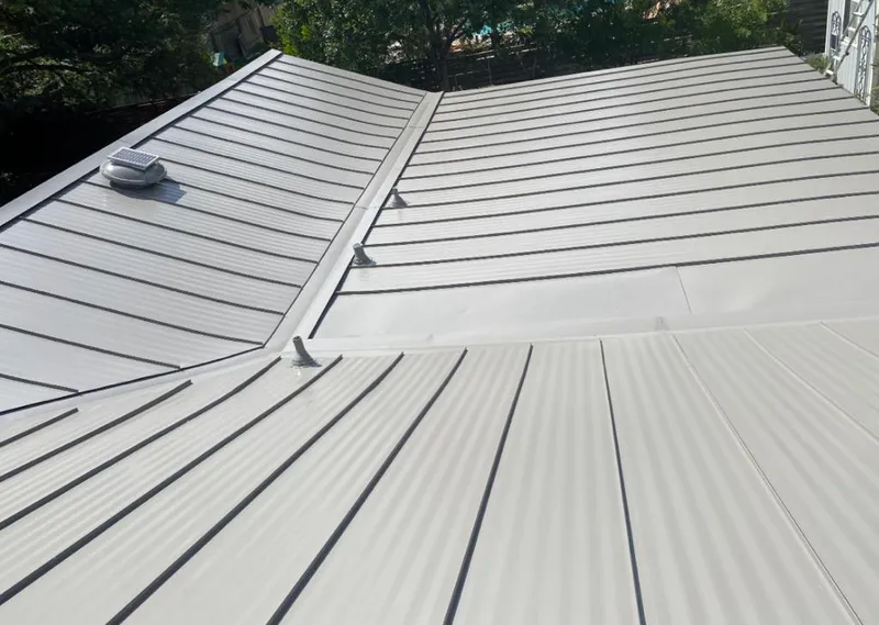 Solar attic fan installed on a metal roof for Roof Ventilation in Marco Island